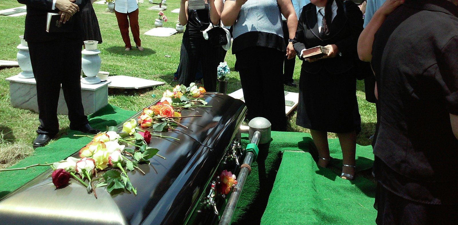 group of people attending burial